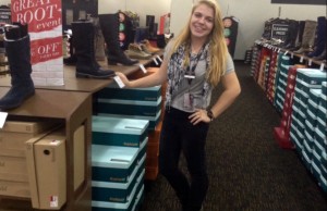 Macey Klipp, senior, stacks boxes at her shift at Off Broadway Shoes, a job she obtained through ROP.